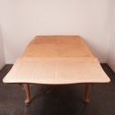 Table à allonges en bois aérogommé